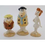 A collection of three Beswick Flintstone figures. To include: Fred Flintstone, Wilma Flintstone