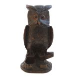 Black Forest : A carved wooden figure of an eared owl formed tobacco pot with ashtray and matchbox