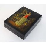 A Russian lacquered hinged box with hand painted image to lid of a woman tending vines. Signed in