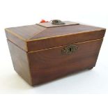 An early 19thC sarcophagus shaped tea caddy with boxwood stringing opening to reveal 2 lidded