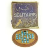 A Chad Valley solitaire set with wooden board and 32 handmade marbles mainly in turquoise  in