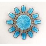 Norwegian silver : A silver gilt brooch formed as a stylised flower head with turquoise guilloché