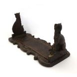 Black Forest : a 19th C folding bookslide , the carved ends formed as seated Foxes or Wolves ,  on a