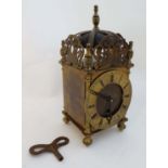 Lantern clock : an early - mid 20 th C brass lantern clock with key wind Sprung movement, Roman