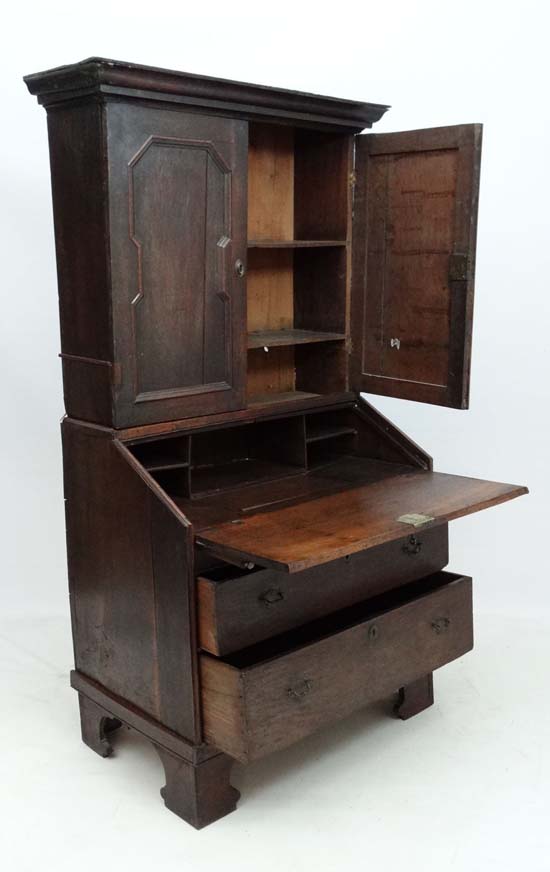 An 18thC George I country made oak bureau bookcase with hinged well section. 37" wide x 71" high x - Image 4 of 7