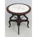 A 19 thC circular center table with a marble top , two tiers ( one of a quatrefoil / cross like