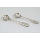 2 silver Fiddle pattern salt spoons one hallmarked London 1830 maker  WC the other Lodnon 1841 maker