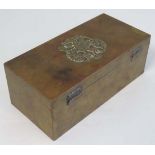 An early 20thC Eastern European hinged lidded brass box with tin lining having twin headed eagle