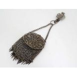 A silver plate purse of chain link form with chain handle and chatelaine attachment. The whole