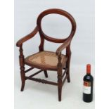 A mid Victorian cane seated child's open armchair 23 1/4" high  CONDITION: Please Note -  we do