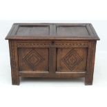 A 17thC oak small coffer with peg joints , twin panelled sections, double carved lunettes and