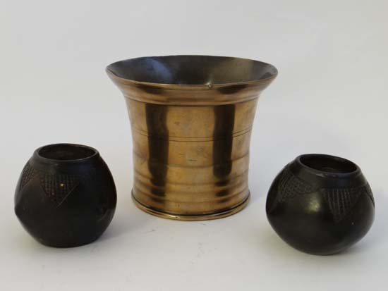 An 18thC cast bronze mortar together with two African native tribal small spherical formed ceramic