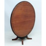Anglo - Indian Table : a 19 thC mahogany tilt top circular table with ebony stringing and border