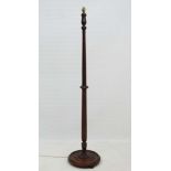 A mid 20thC walnut stained beech standard lamp, standing approx 70" high  CONDITION: Please