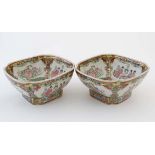 A pair of  20thC Cantonese famille rose bowls of square chamfered form, the Cartouches decorated