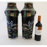 A Pair of tall famille noire Chinese vases of cylinder form, decorated with figures and horses in