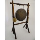 A 19thC bamboo framed dinner gong with 2 beaters . Standing 33" high x 21 1/2" wide  CONDITION: