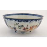 A large blue and white Chinese bowl having hand painted poly chrome cartouches decorated with images