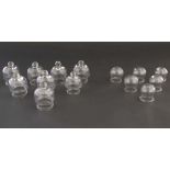 Alternative medicine :  two sets of clear glass ' Cupping glasses ' , one with knop ends the