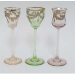 C. 1900 Glass : Three pedestal glasses ( liquor glasses ) , of green, violet and pale yellow colours