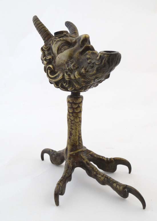 A 19thC classical bronze formed as a pedestal oil lamp in the 17thC style , a satyr head upon a