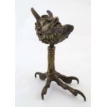 A 19thC classical bronze formed as a pedestal oil lamp in the 17thC style , a satyr head upon a