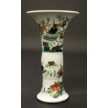 A Chinese famille rose gu shaped vase , decorated in polychrome enamels with birds and insects in