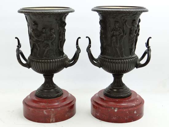 Claude Michel Clodion (1738-1814), A pair of Patinated bronze campana urns depicting classical