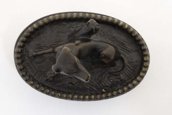 A Regency patinated bronze oval desk weight in the form of a sejant dog. 3 1/4" wide x 2 3/4" - Image 6 of 6