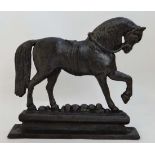 A 19thC cast iron door porter / door stoop in the form of a military horse on stand 9 3/4" long x 9"
