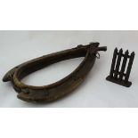 A 19thC full oak and straw flocked leather horse collar having curved oak hames. 22 1/'2'' .