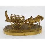 A 19thC gilded cast bronze sculpture, a horse pulling a cart with barking dog, on an oval base. 7