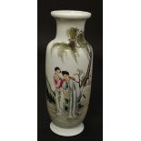 An early 20thC Chinese famille rose baluster vase , decorated with female figures in a garden