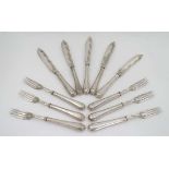 Assorted flatware to include a set of 6 silver pistol grip handled butter knives hallmarked