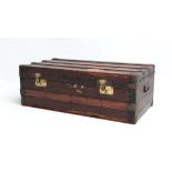 A late 19thC travel trunk with canvas and wood bound, twin carry handles and brass locks. 33" wide x