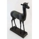 A 19thC patinated bronze sculpture of a deer faun on squared base. 21 1/2" high x 13 1/3" long