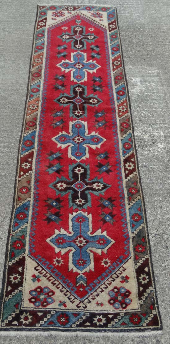 Rug / Carpet : a  Caucasion Runner with Latch-Hook  design and 8 pointed star decoration , with