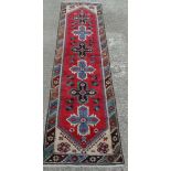 Rug / Carpet : a  Caucasion Runner with Latch-Hook  design and 8 pointed star decoration , with