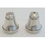 A HM silver salt and pepper cruet hallmarked Birmingham 1932 maker S J Levi & Co. each pot approx