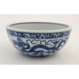 A large Chinese blue and white bowl, decorated with 5 clawed dragons, with blue Chinese 6