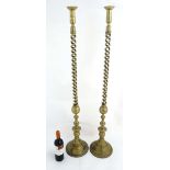 A pair of rare and unusual exceptionally tall brass double open twist candlesticks on circular