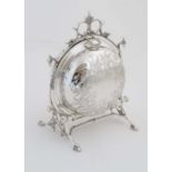 A silver plate folding biscuit box the ornate frame with bird  head decoration, folding open to