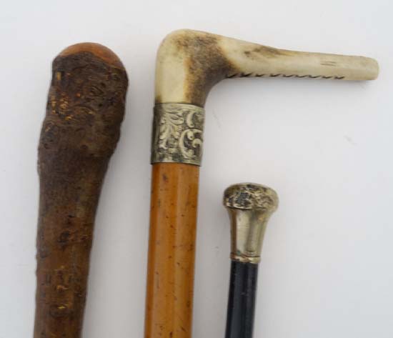 A Victorian mallacca cane with antler handle and embossed brass collar together with a swagger stick - Image 3 of 3