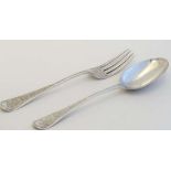 A silver Christening spoon and and fork with engraved decoration,. Hallmarked London 1876 maker