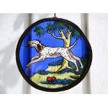 Stained Glass : a pendant circular section with lead surround of a sporting dog in country