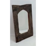 A 17thC oak door made into a lancet shaped mirror. Bears writing verso stating '  from the Judge's