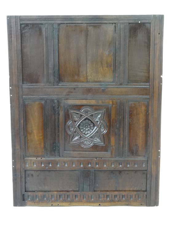 17thC wall panel : An oak peg jointed panel with central carved rose ivy leaf and lunette decoration