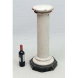 Pedestal  : a painted circular ceramic column standing on a faux marble octagonal wooden base ,