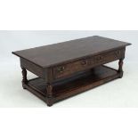 A 20thC peg jointed oak coffee table having two frieze drawers and open section 17 1/2" high  x