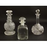 Decanters : three assorted glass decanters comprising of a 3 ring and facet cut decanter, onion